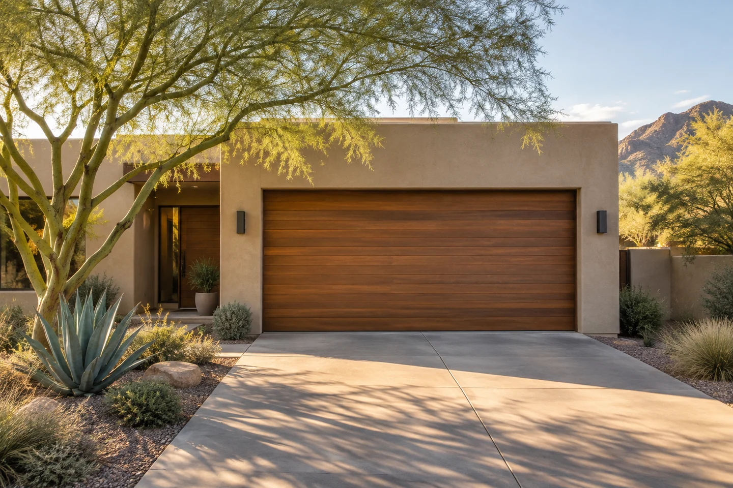 Warm Arizona-style home with a cedar garage door and desert landscaping